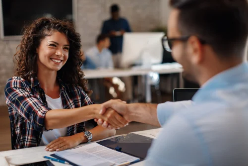 Handshake man interviewing woman